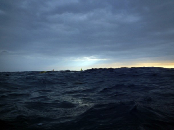 The sun goes down on us in the water